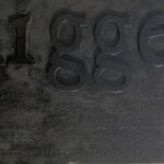 contemporary art words nigger on wood painted black, by artist Manuel Palacio